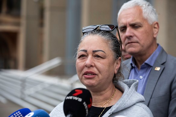 Former Qantas worker Anne Guirguis  speaks to the media outside the Federal Court after the airline was fined $90 million. 
