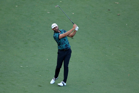 Dustin Johnson plays a shot. 