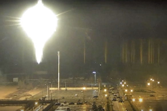 This image made from a video released by Zaporizhzhia nuclear power plant shows a bright flaring object landing in grounds of the nuclear plant. 