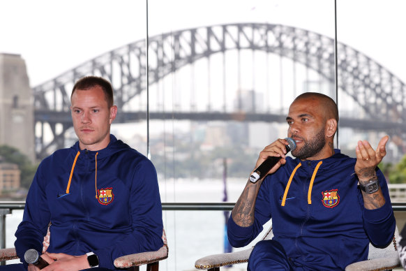Barcelona player Marc-André ter Stegen looks on as Dani Alves speaks to the press in Sydney in May 2022.