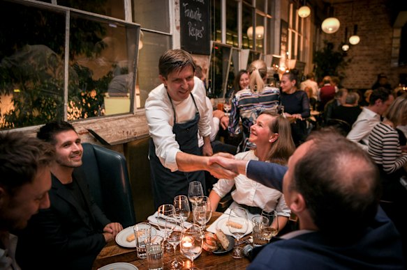 Andrew McConnell greeting diners during an event at Cumulus Inc. in 2019.