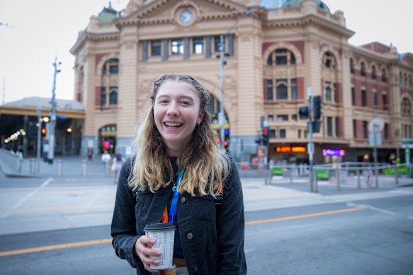 Tara Kennedy makes her way through the Melbourne CBD on Monday after mask rules indoors were loosened. 