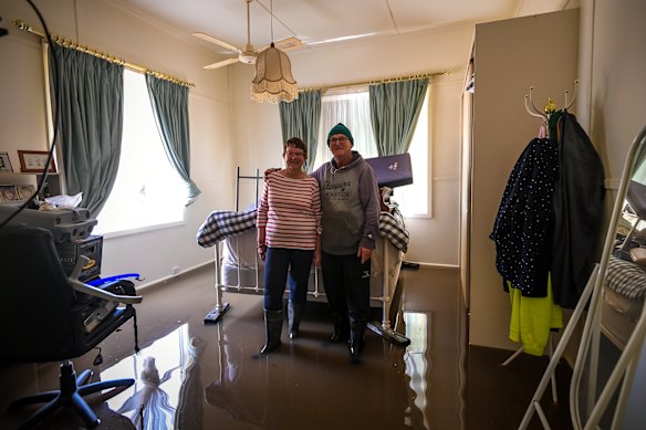 Glenys and Brian in their flooded home in October 2022. 