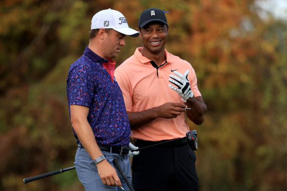 Justin Thomas, left, and Tiger Woods, right, on the 18th hole during the first round of the PNC Championship. 