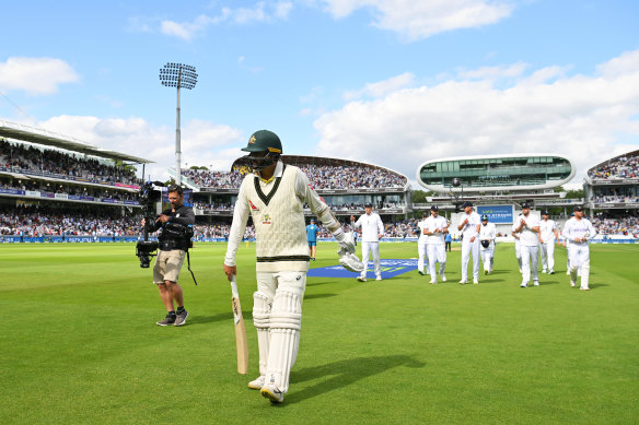 England’s players follow Nathan Lyon off the field at the end of Australia’s innings.