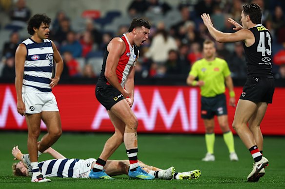 Rowan Marshall of the Saints celebrates kicking a goal.