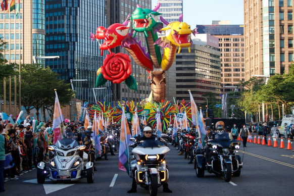 A procession of performers during a DPP political rally in downtown Taipei. 