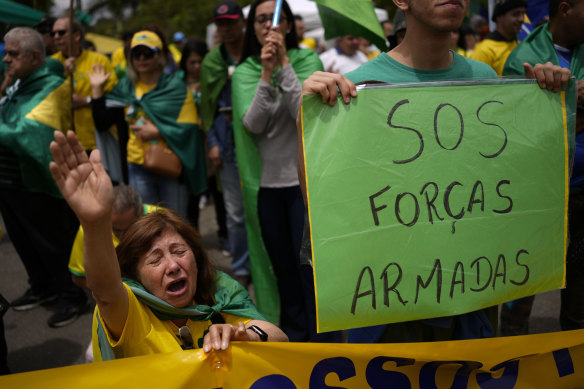 Supporters of outgoing President Jair Bolsonaro protest against his defeat and ask for miliary intervention outside a military base in Sao Paulo, Brazil.