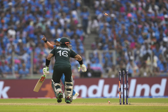 Pakistan’s Muhammad Rizwan is bowled by India’s Jasprit Bumrah.