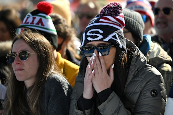 American fans react at the women’s downhill skiing after Lindsey Vonn’s crash.