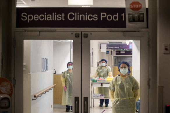 PPE-protected staff at Sunshine Hospital's coronavirus ward prepare for what's to come in March. 