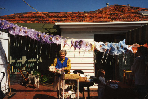 Edie Stott with cupie dolls hanging in her Maidstone backyard in the early 1980s.