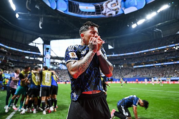 Enzo Fernandez kisses his badge after Argentina’s second goal. 