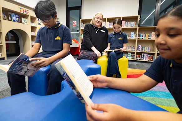Sunshine Primary School principal Lyn Read with year 5 students Saqeef , Ivy and Afnan.