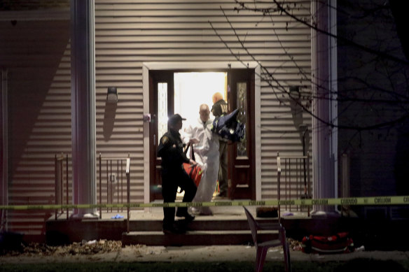 Police at a residence in Monsey early on Sunday following a stabbing during a Hanukkah celebration at a rabbi's house on Saturday, 