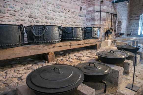 Bronze caldrons and cooking pots in the Palace Kitchens.