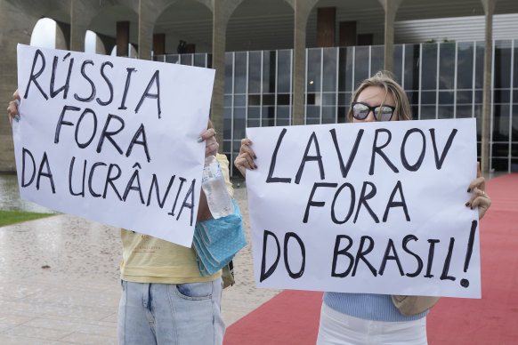 Demonstrators protest outside Itamaraty Palace in Brasilia holding signs that read in Portuguese “Russia, get out of Ukraine” and “Lavrov, get out of Brazil” during Russian Foreign Minister Sergei Lavrov visit.