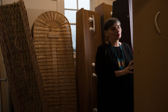 Founder of Tender Funerals, Jenny Briscoe-Hough, with a range of coffins, in Port Kembla. 