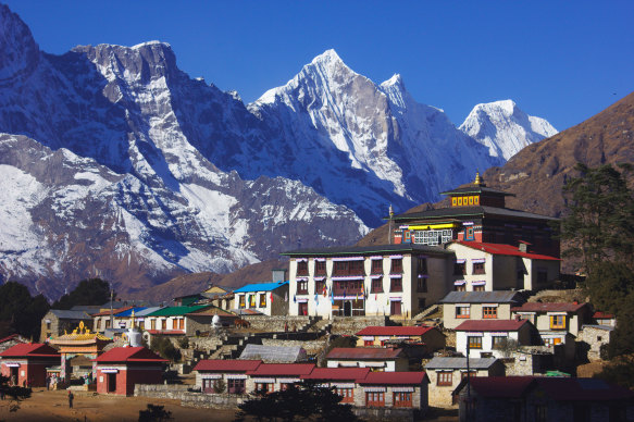 Tengboche monastery at Thyangboche, Nepal with Himalayan peaks in the background.