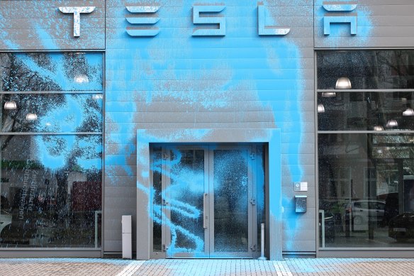 A Tesla car dealership in Berlin doused in blue paint.