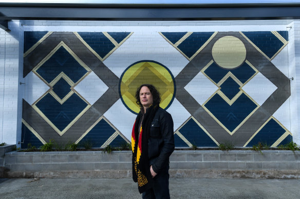 Artist Kent Morris in front of his new mural called ‘Ancestral Connections – The Ties That Bind’ in Brunswick. 