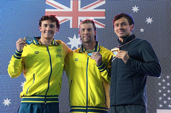 Matt Temple (centre) won gold in the men’s 100m butterfly. 