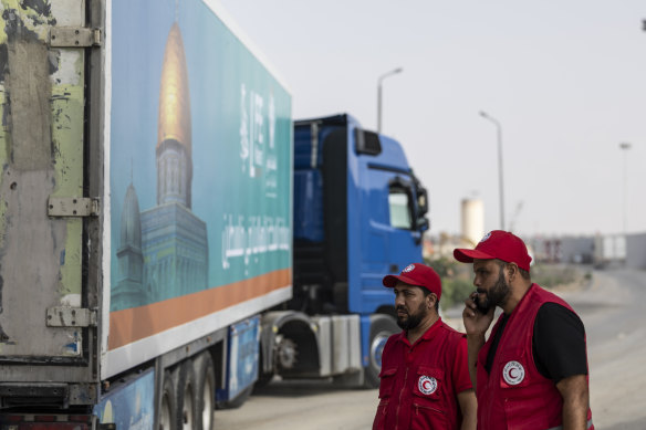 A second convoy of aid trucks crosses the Rafah border from the Egyptian side into the Gaza Strip on October 22.