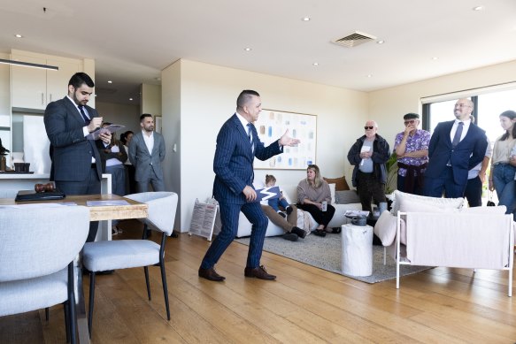 Auctioneer Clarence White in action at 25/40 Maria Street, Petersham.