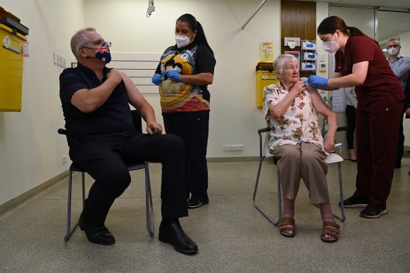 Prime Minister Scott Morrison (left) and Jane Malysiak (right) receiving their COVID-19 boosters in November 2021.