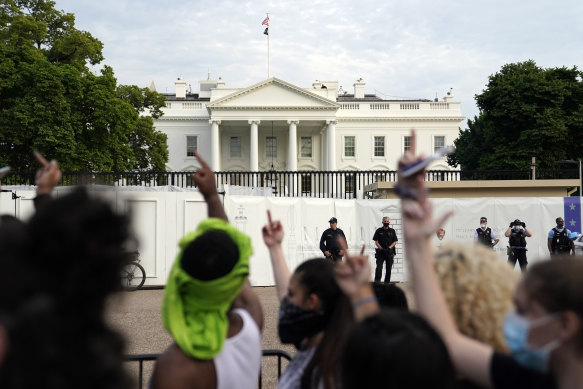 Demonstrators gather across from the White House on Friday to protest the death of George Floyd, a black man who died in police custody in Minneapolis.