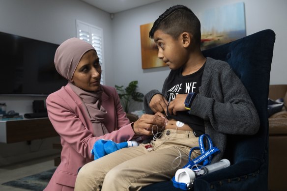 Javeria Ahmad gives Ismaeel his fortnightly infusion of medication made from donated blood plasma.