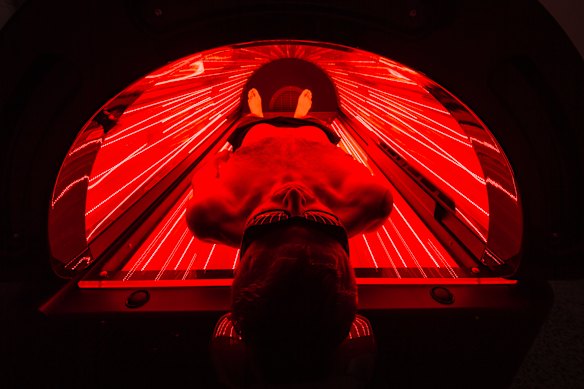 Naum Sekulovski inside a red light therapy bed at P3 Recovery Centre in Richmond.