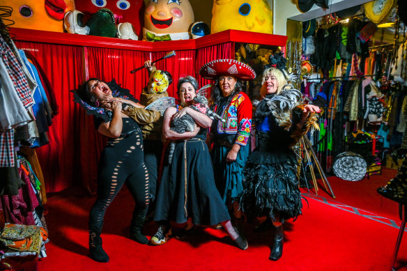 Staff get scary at Rose Chong Constumiers in Fitzroy, Melbourne. From left: Mia Rizzi, Dan Knight, Hannah Cuthbertson (with cat Harpo Marx), Ali Grixti and Abi Wright.