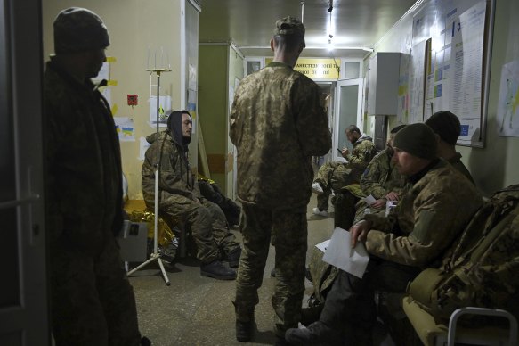 Ukrainian soldiers fill the waiting room. Most are suffering from concussion and shrapnel injuries.