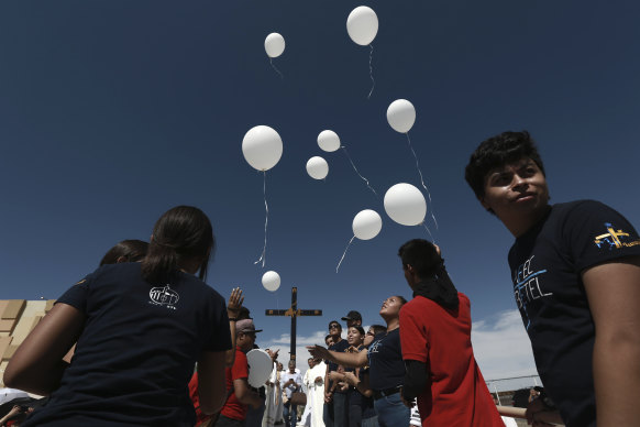Mourners release balloons during a Mass for peace, in Ciudad Juarez, Mexico.