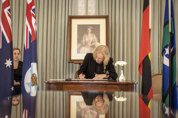 Queensland Governor Jeannette Young signs a condolence book at Government House after Queen Elizabeth II’s death in 2022.