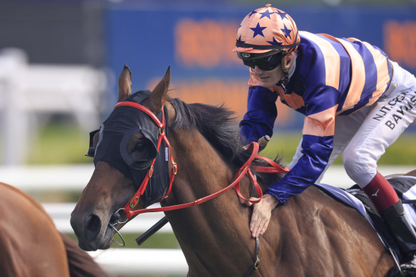 Job well done . . . Regan Bayliss gives Brutality a pat after winning the Villiers.
