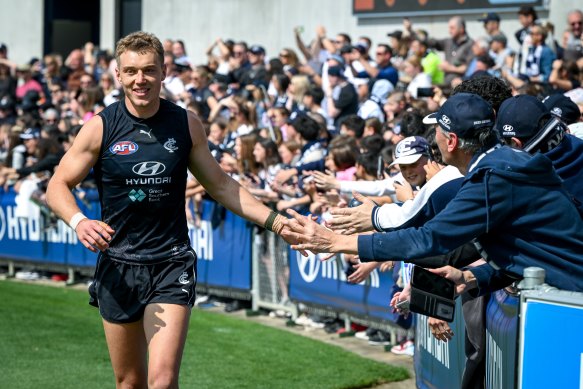 Carlton captain Patrick Cripps greets fans at training on Monday.