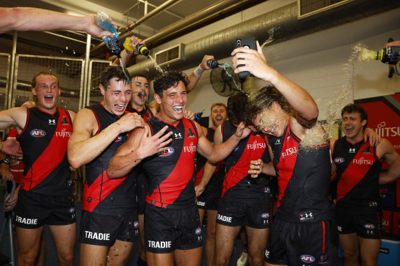 The Bombers celebrate their first win of the season.