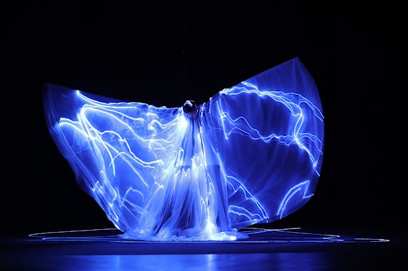 The centrepiece of the Iris van Herpen haute couture show in Paris was a bioluminescent dress made from living algae.