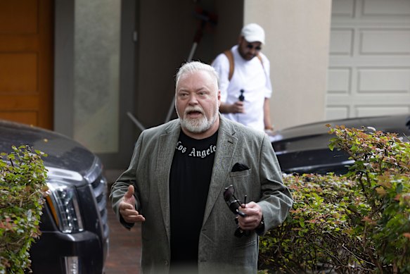 Kyle Sandilands addresses media outside his Vaucluse home on Tuesday.