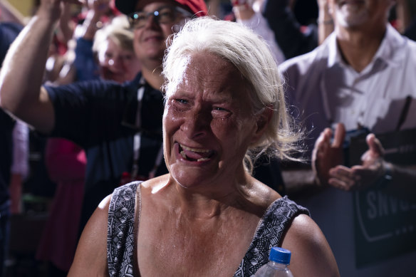 A supporter of President Donald Trump cries as he walks off stage after speaking at a campaign rally at Cecil Airport, Jacksonville, Florida.