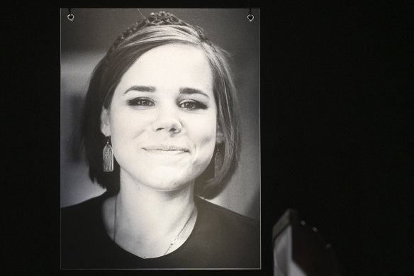 A portrait of Daria Dugina is seen as relatives hold her final farewell ceremony in Moscow.