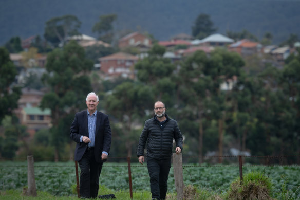 Farmland on Melbourne's city fringe has been central to how well Melbourne is coping during the coronavirus pandemic, academics Michael Buxton (L) and Andrew Butt say.