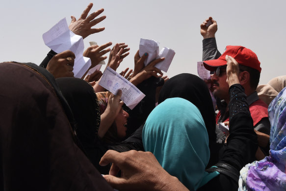 Islamic State has left a trail of devastation across the Middle East. Here, Iraqi women queue for food and water on the outskirts of West Mosul in July 2017. The offensive to retake Mosul from Islamic State saw more than one 1 million people displaced.