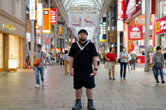 Fashion business owner Ryo Izumi in Hiroshima’s shopping district. 
