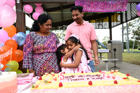 Tharnicaa Nadesalingam (centre) celebrates her fifth birthday with her parents Priya and Nades and her sister Kopika on June 12, 2022 in Biloela, Queensland.