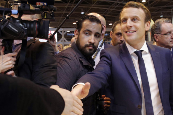 Then presidential candidate Emmanuel Macron, front right, flanked by Alexandre Benalla in Paris in 2017.