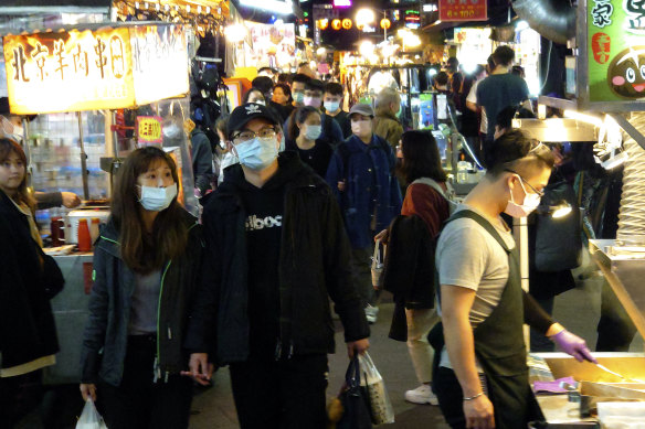 People visit at a night market in Taipei, Taiwan, last week. 