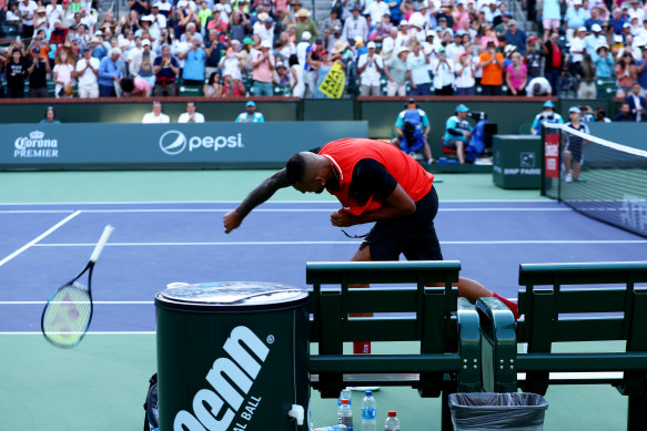 Nick Kyrgios smashes his racquet during his match against Rafael Nadal